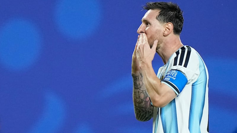 Argentina's Lionel Messi reacts after scoring his third goal during the World Cup Group J...